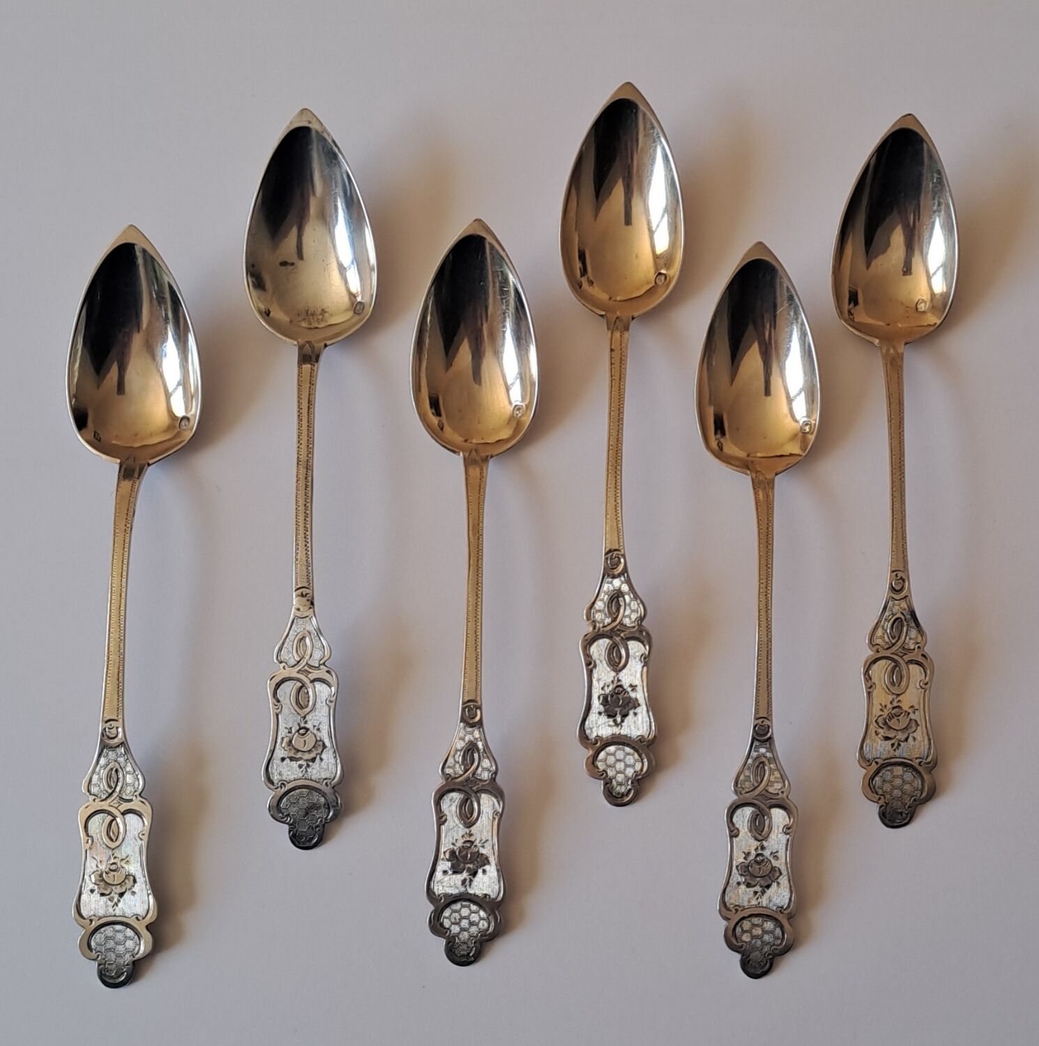 6 small numbered silver teaspoons, Minerva hallmark.