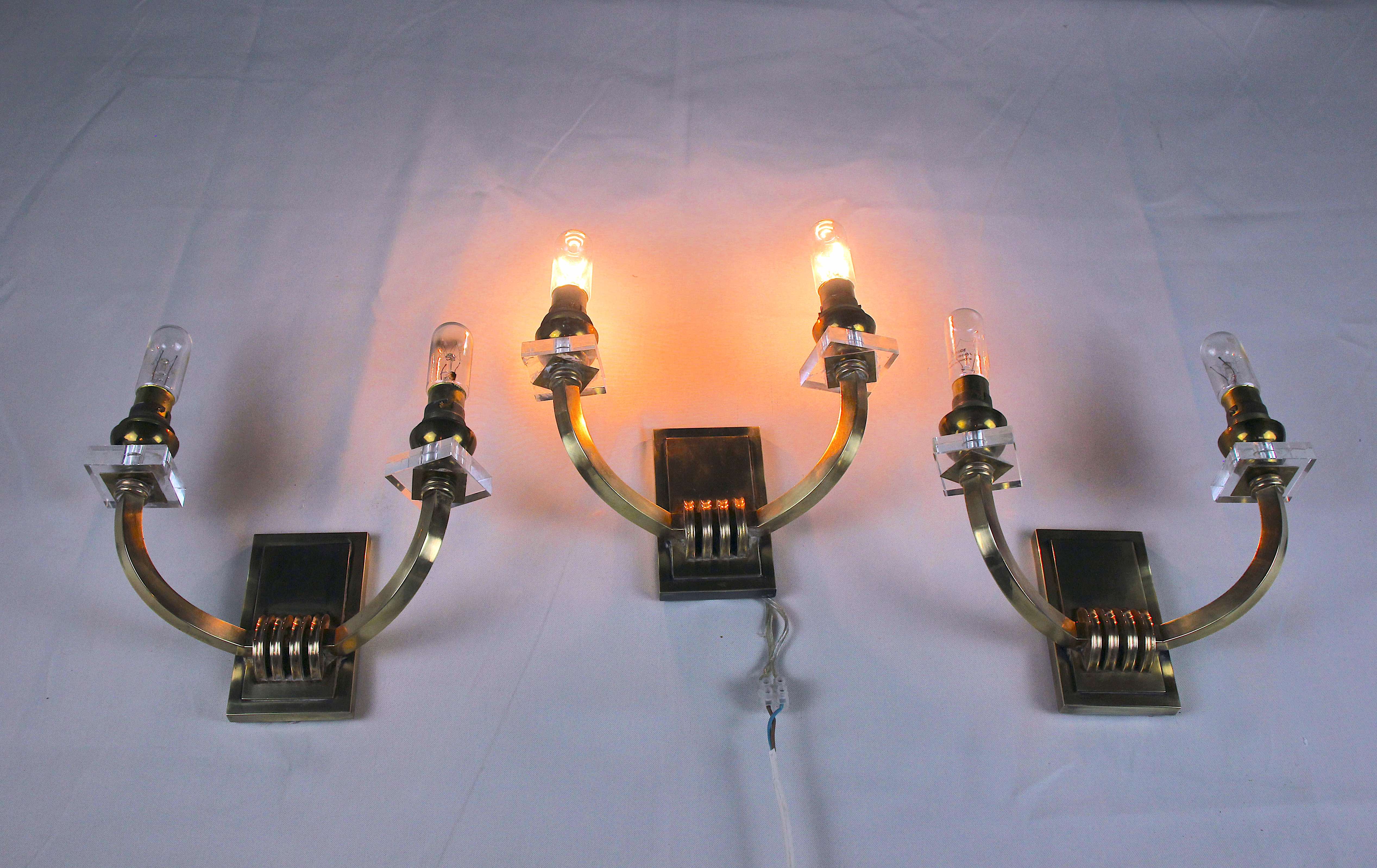 Three double wall lamps  Brass and lucite, France Mid-Century