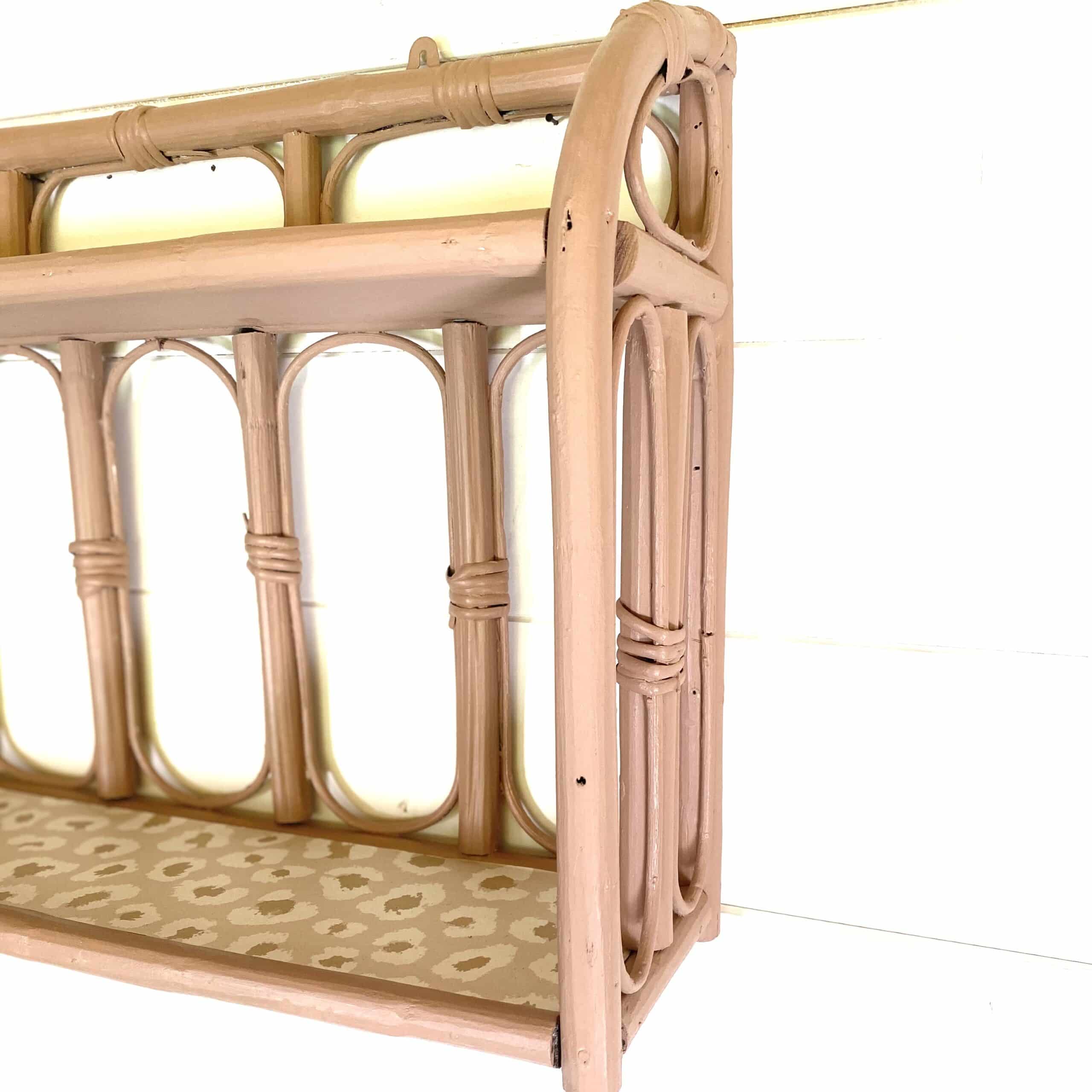 Pale pink rattan wall shelf