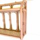 Pale pink rattan wall shelf