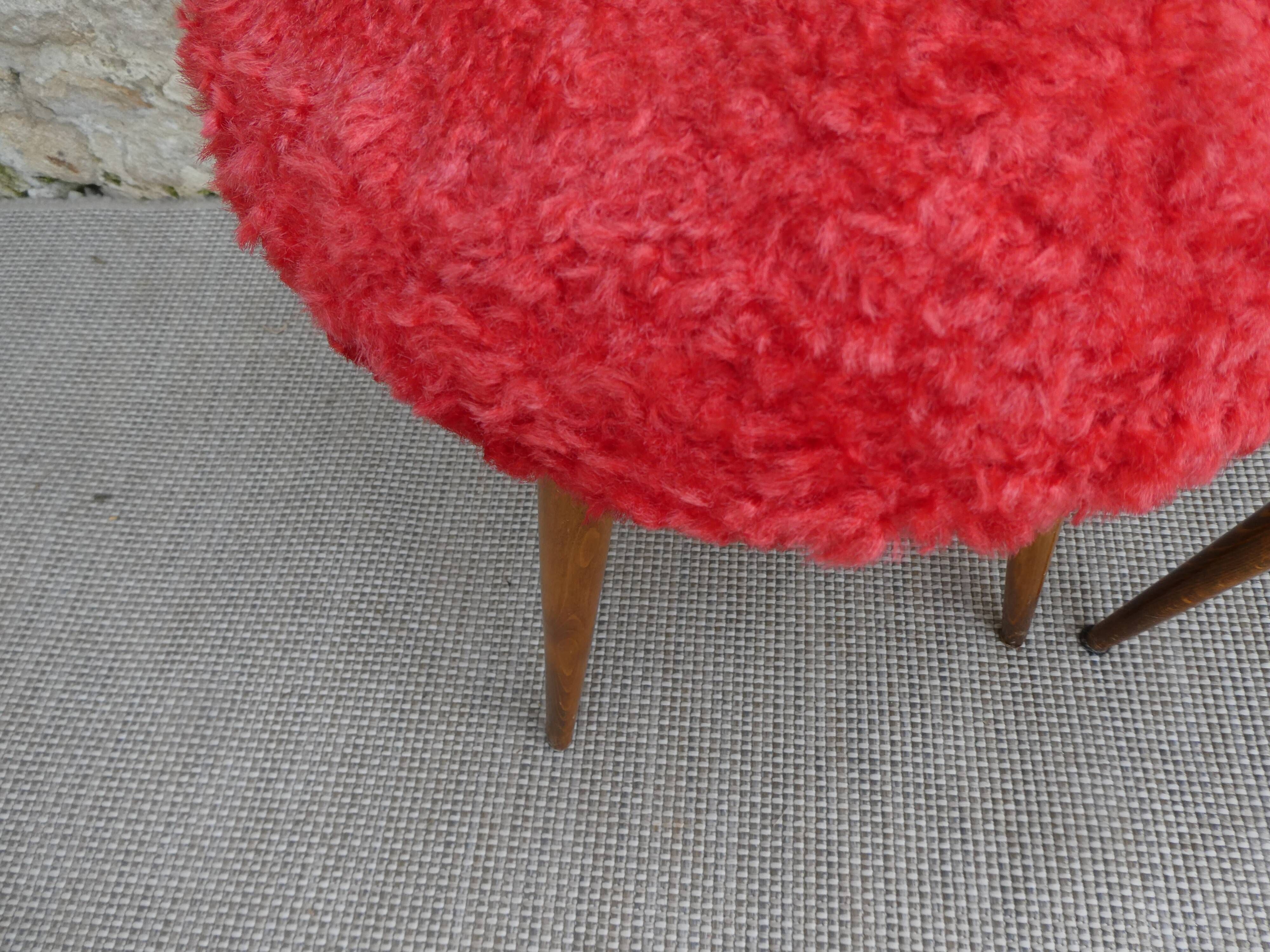 Pair of tripod stools, with tapered wooden feet and moumoute seat
