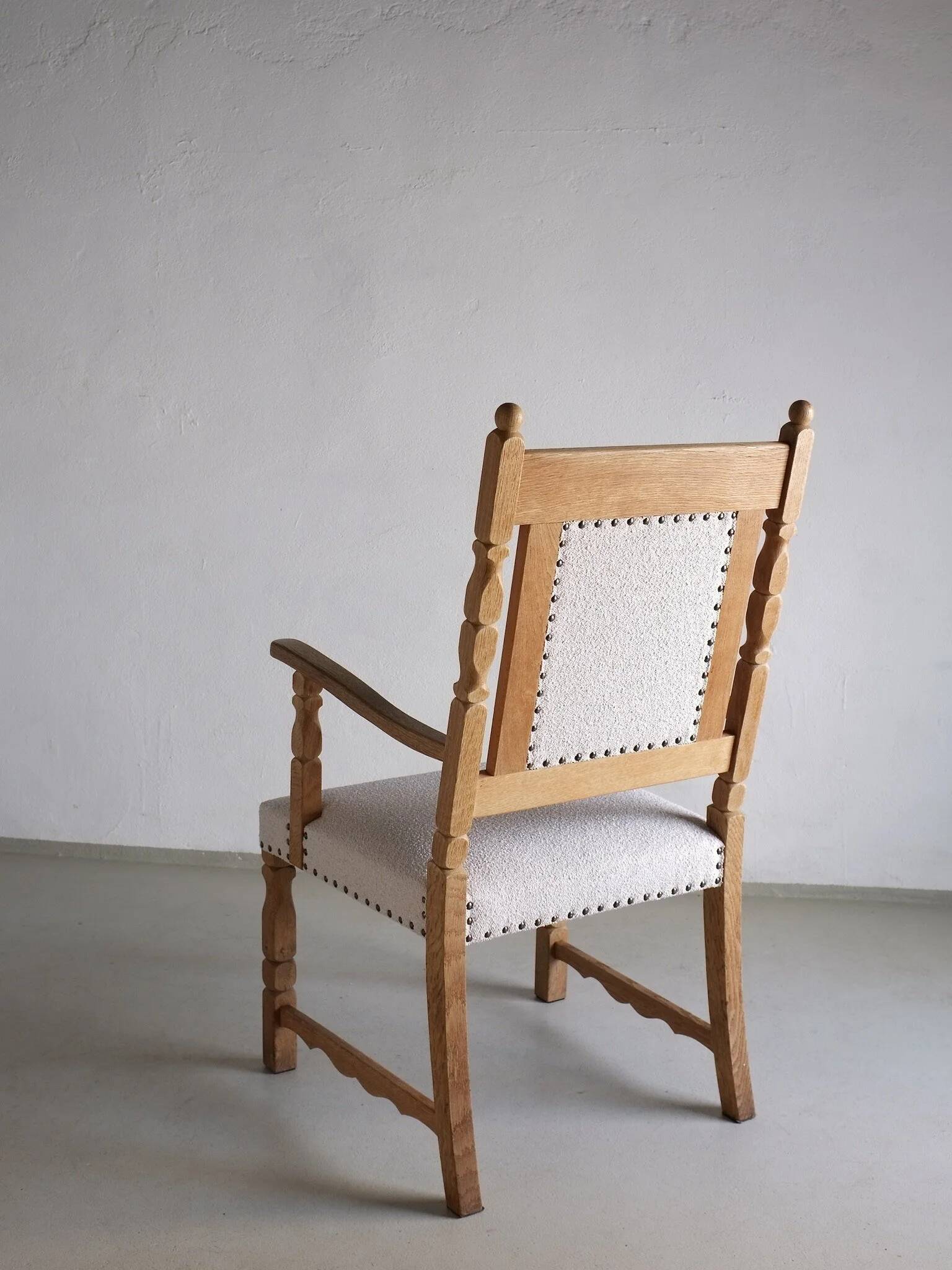 Carved oak armchair by Henning Kjaernulf | Denmark | 1960s
