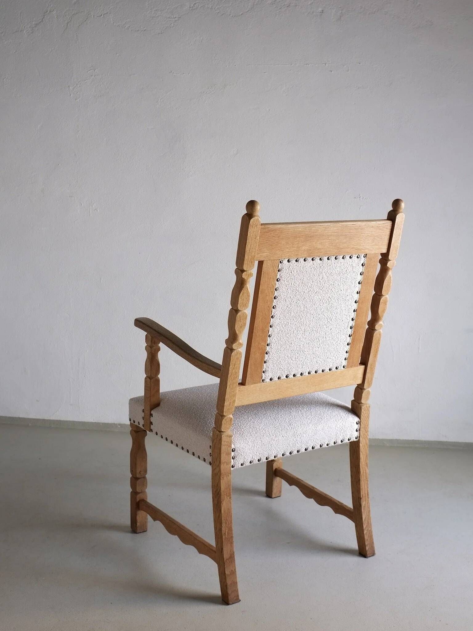 Carved oak armchair by Henning Kjaernulf | Denmark | 1960s