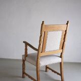 Carved oak armchair by Henning Kjaernulf | Denmark | 1960s