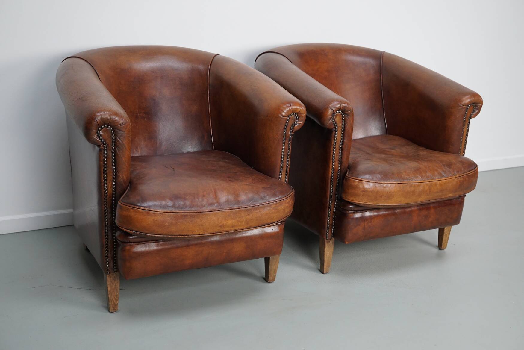 Vintage Dutch cognac coloured leather club chair, set of 2 with footstool