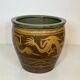 Importante jardinière chinoise en terre-cuite vernissée à décors de dragons