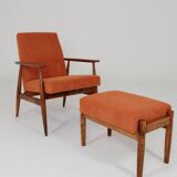Vintage armchair and footrest in orange corduroy.