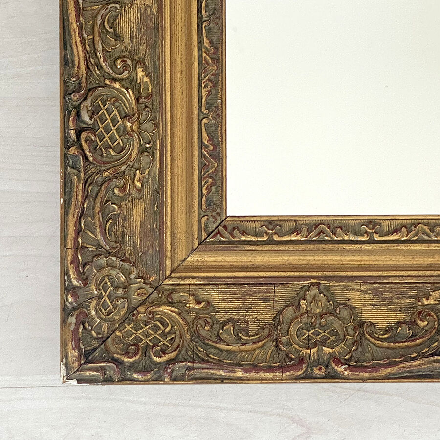 Small old mirror in gilded wood