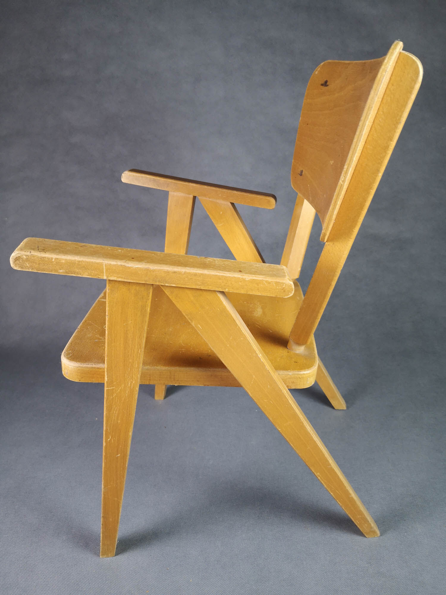 Vintage armchair child feet compass light wood