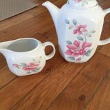 Vintage porcelain coffee or teapot with milk jug