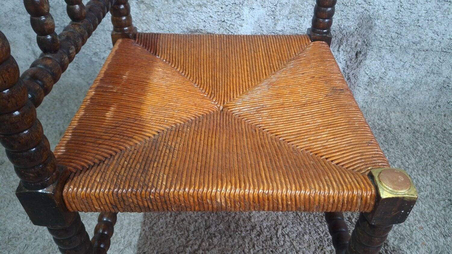 Fireplace corner chair in Louis XIII style, turned wood with braided rush, 19th century.