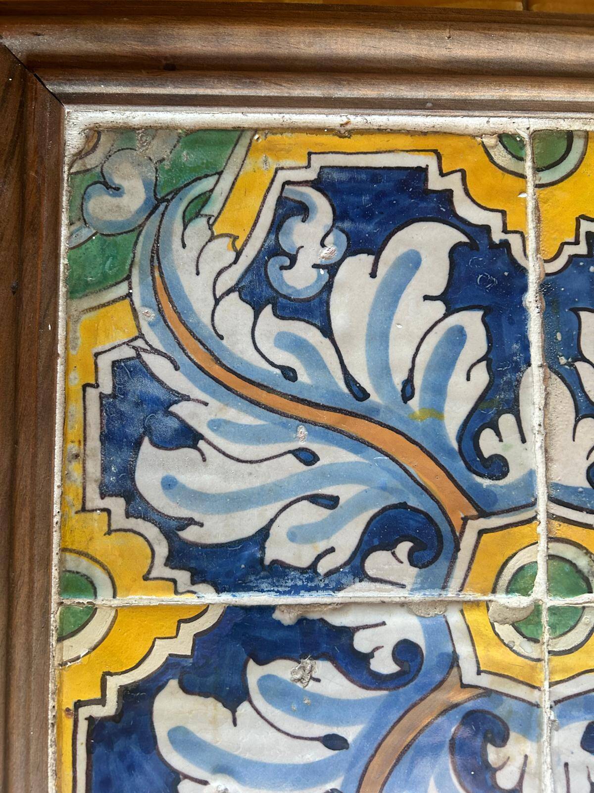 Panel of four Catalan tiles, 17th century, framed.
