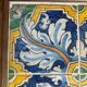 Panel of four Catalan tiles, 17th century, framed.