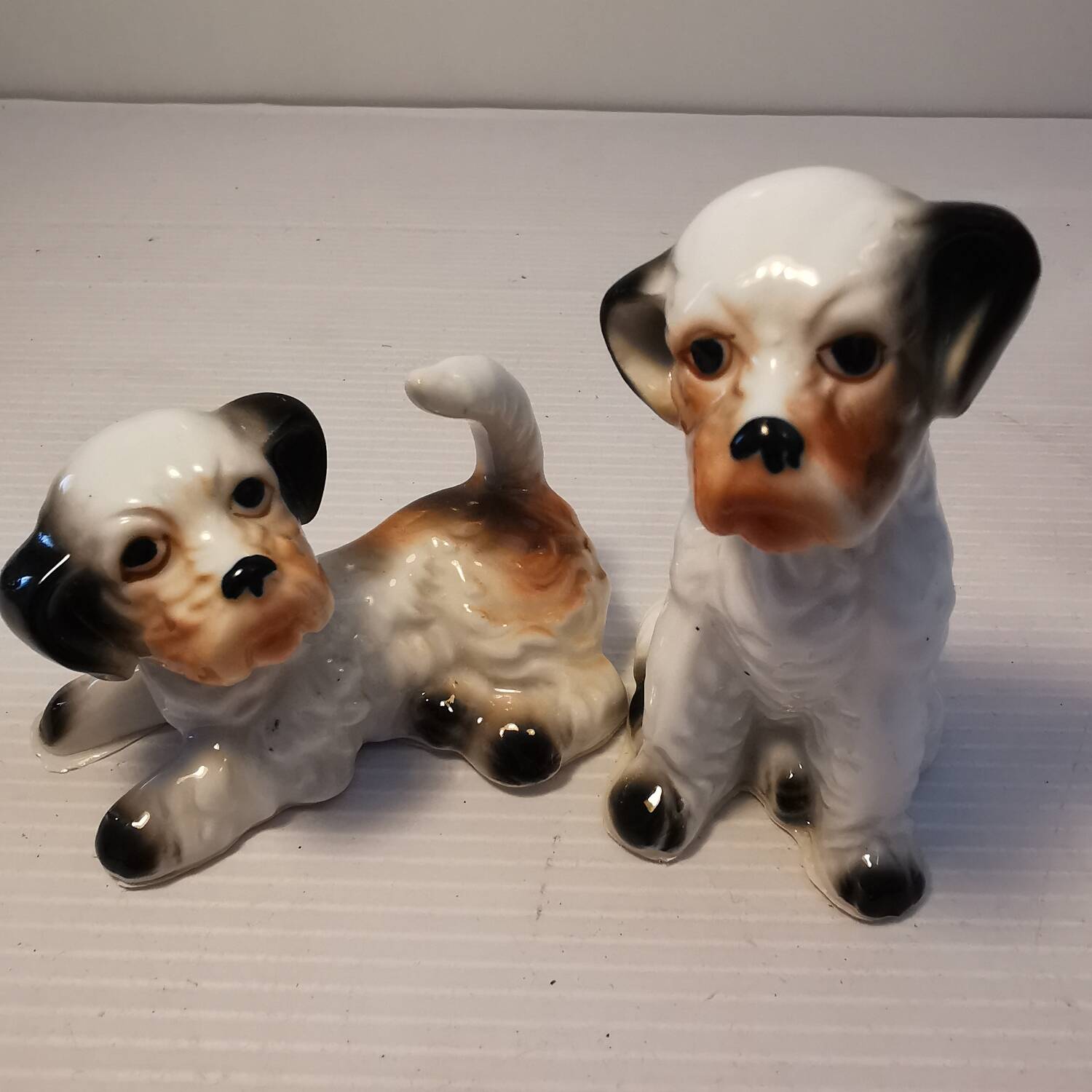 Pair of vintage ceramic terrier puppy dog figurines