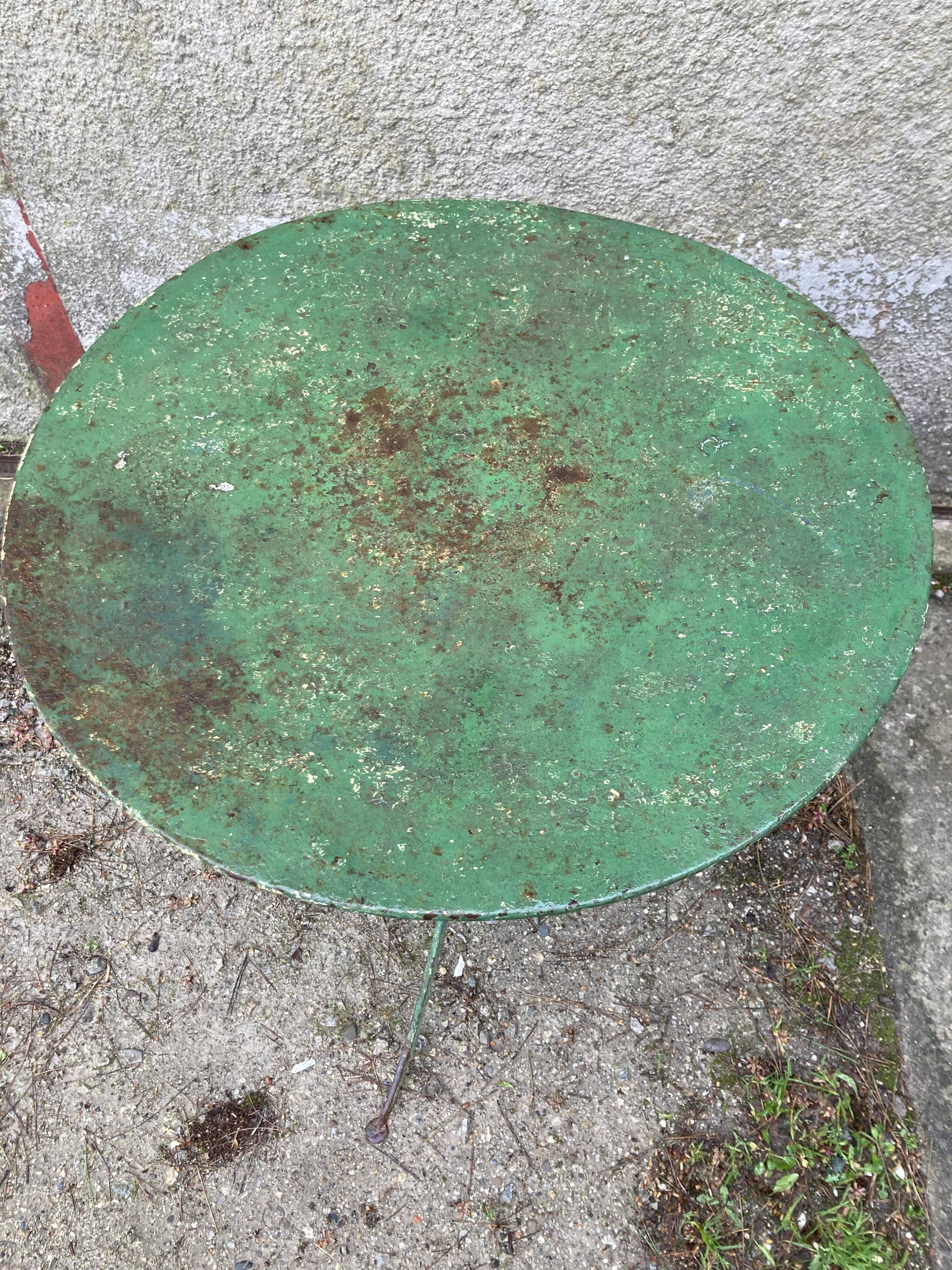 Riveted green old garden pedestal table