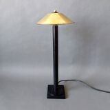 Post-Modern lamp in black metal and gilded brass.