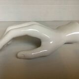 Coat hook representing a hand
