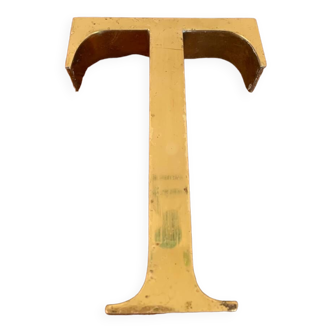 Golden sign letter “T”