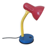 Desk lamp in Memphis colours: red, blue, yellow.