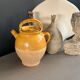 Ancient oil jar in glazed terracotta