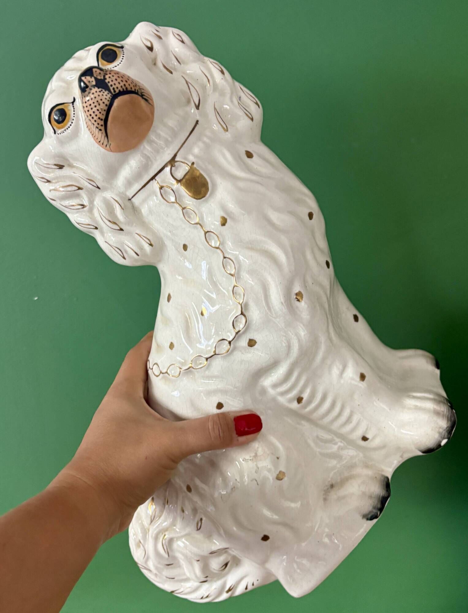 Pair of Staffordshire-type dogs in white and gold ceramic