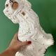Pair of Staffordshire-type dogs in white and gold ceramic