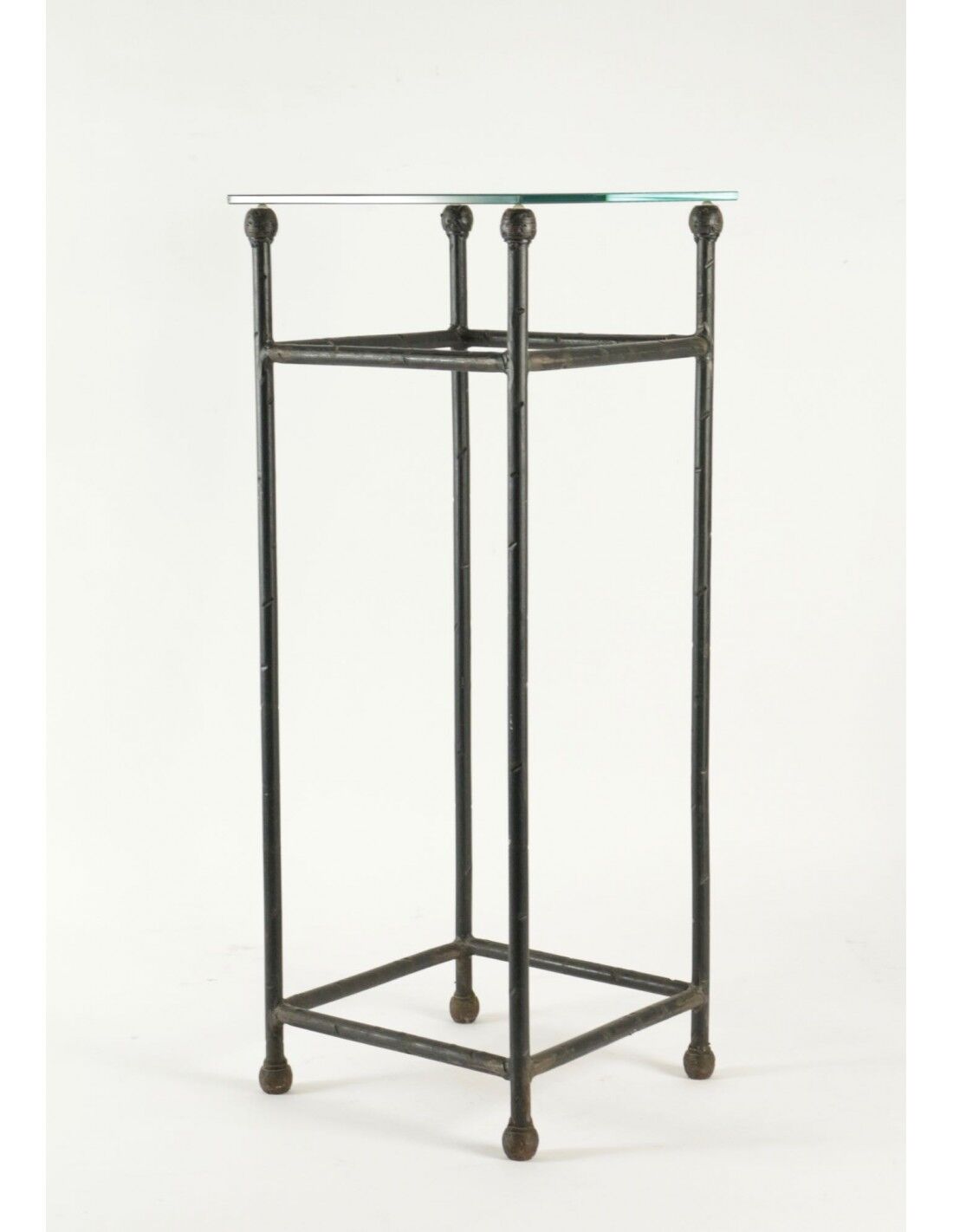 Two consoles, wrought iron sheaths on glass top, twentieth century