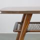 Mid-century German coffee table with rattan shelf and brass legs