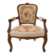 Louis XV style carved wooden armchair with floral needlepoint upholste