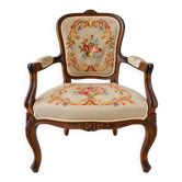 Louis XV style carved wooden armchair with floral needlepoint upholste