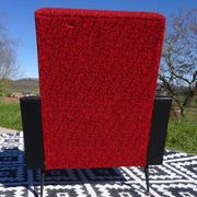 Pair of vintage armchairs in black faux leather and red fabric.