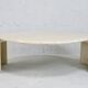 Table basse de forme courbe, travertin, France, circa 1970.