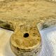 Old large round pizza cutting board