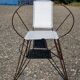Vintage armchair in black metal and white plastic caning.