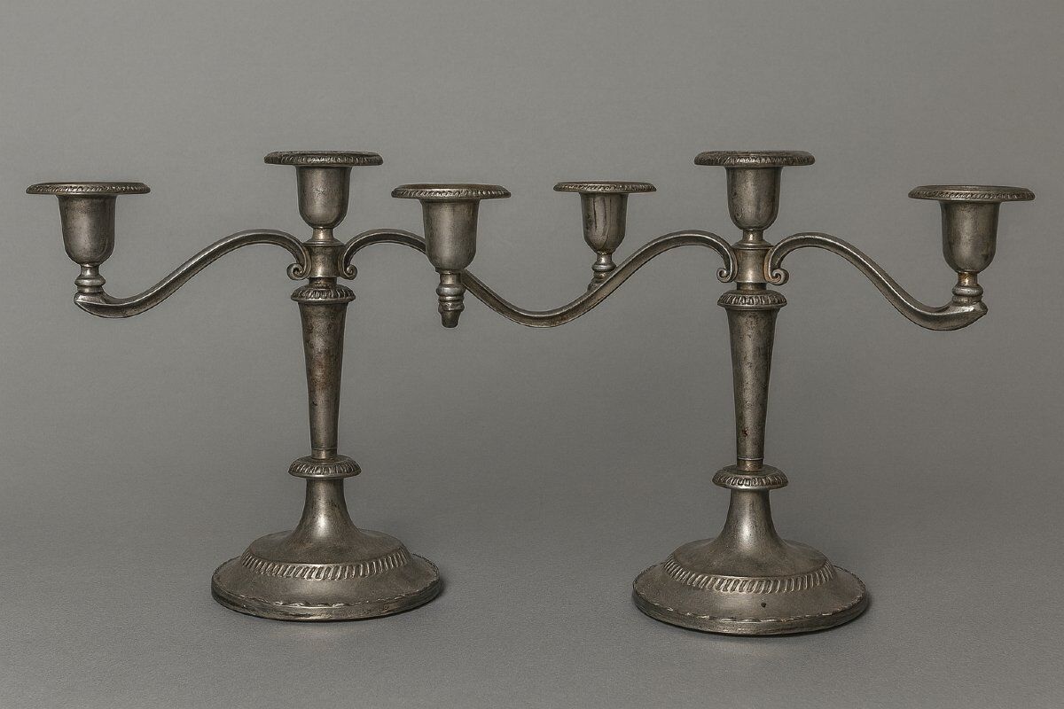 Pair of three-light candlesticks in silver-plated metal