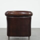 Stylish and sturdy dark brown club armchair made of sheepskin leather