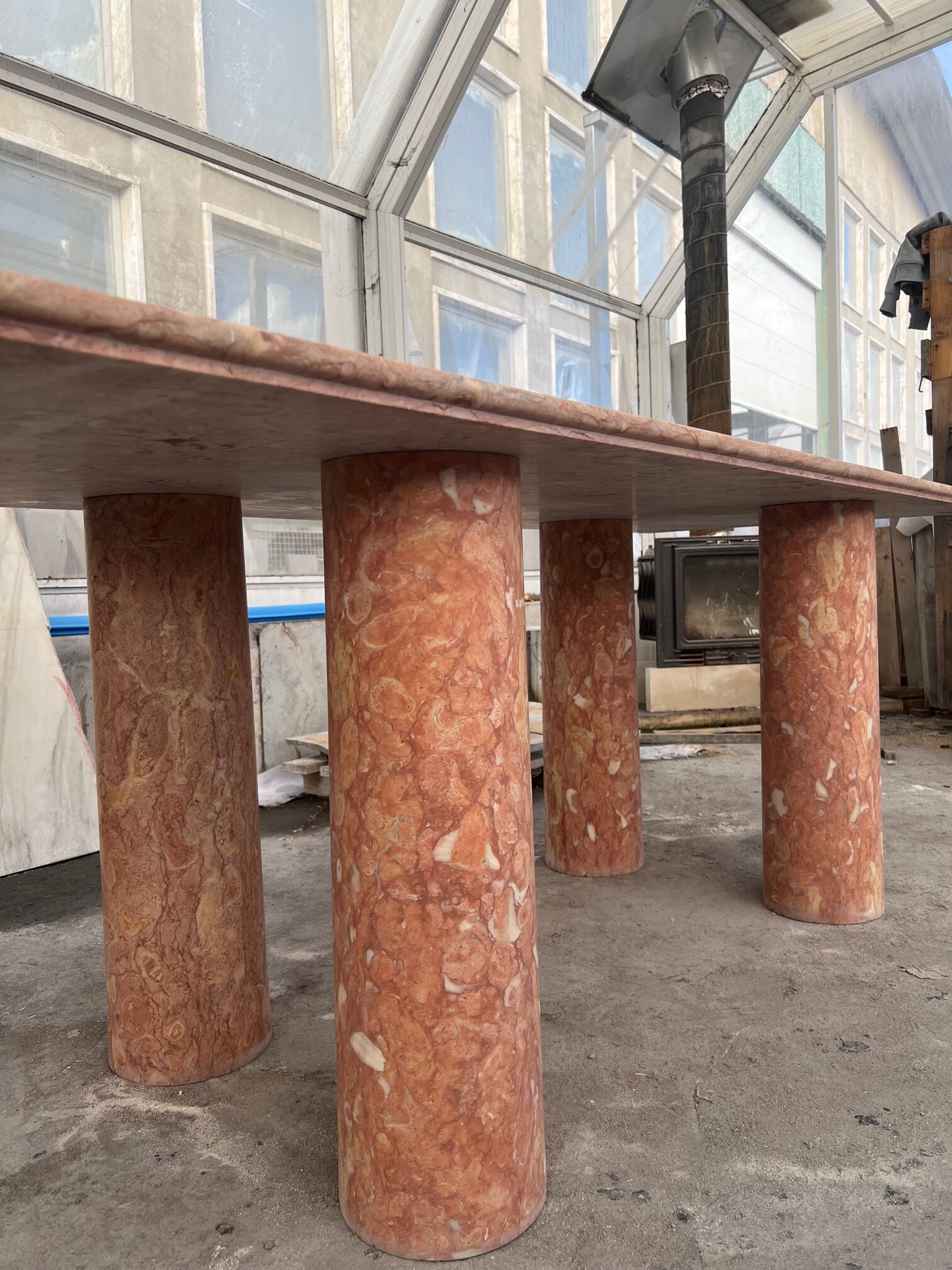 Large rectangle stone dining table in red/pink Portuguese Travertine