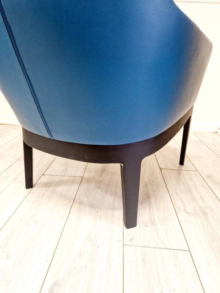 High-back armchair by Rodolfo Dordoni