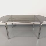 Vintage oval dining table in smoked glass and chrome metal, Space Age style.