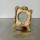 Metal gold colored picture frame brass