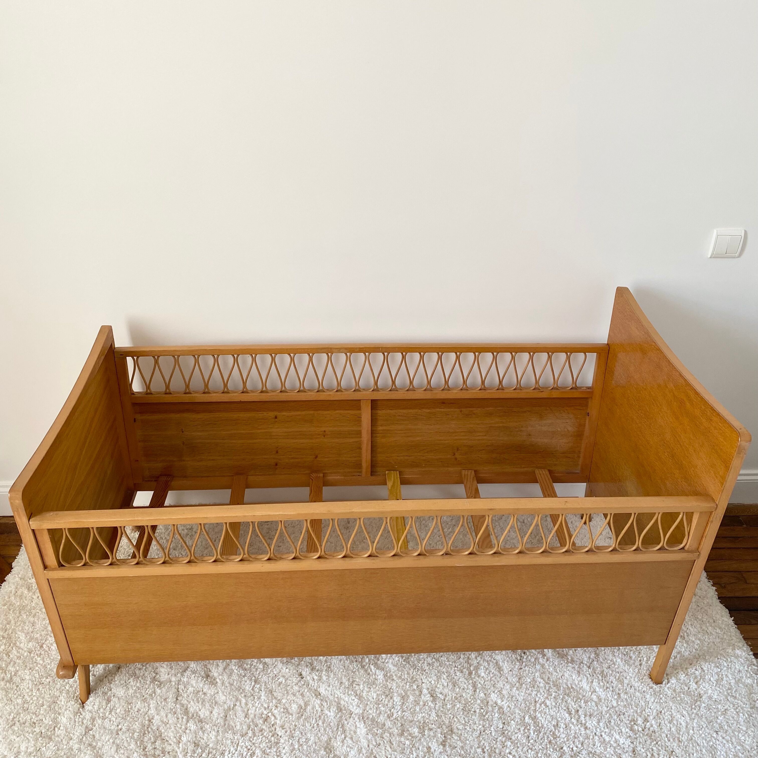 Vintage wooden baby cot and rattan strap