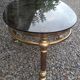 Oval coffee table in gilded brass and smoked glass 1970