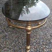 Oval coffee table in gilded brass and smoked glass 1970
