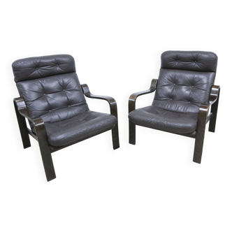 Paire de fauteuils vintage en cuir et palissandre 1960