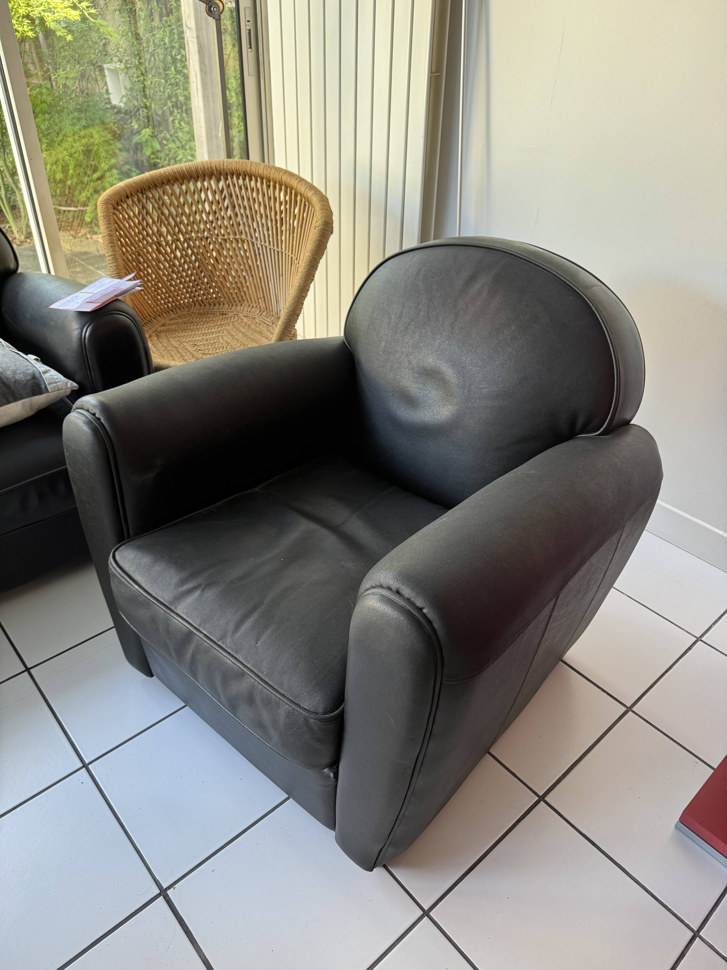 Matching black leather armchair – comfort and elegance