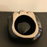 Black ceramic ashtray left hand