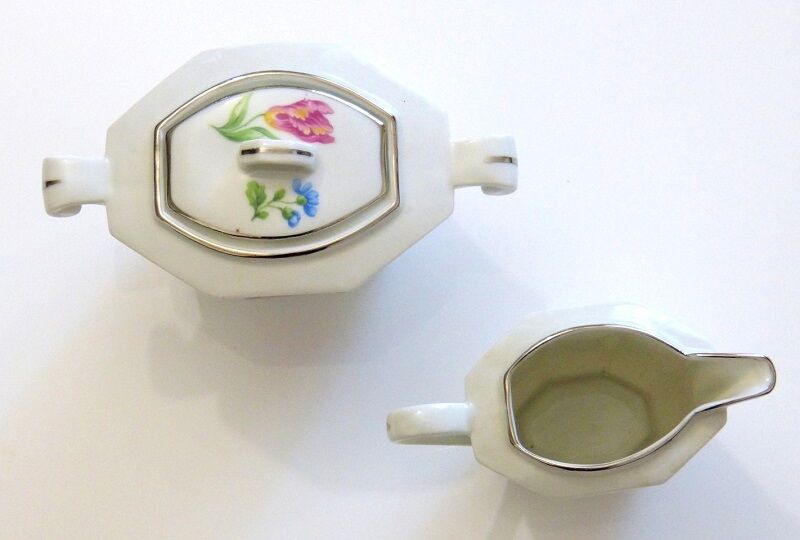 Ancient milk pot and sugar bowl in earthenware decorated with ancient roses