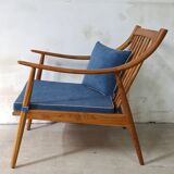 Paire de fauteuils cosy en teck avec coussins