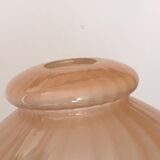 Globe with transparent peach colored glass rims