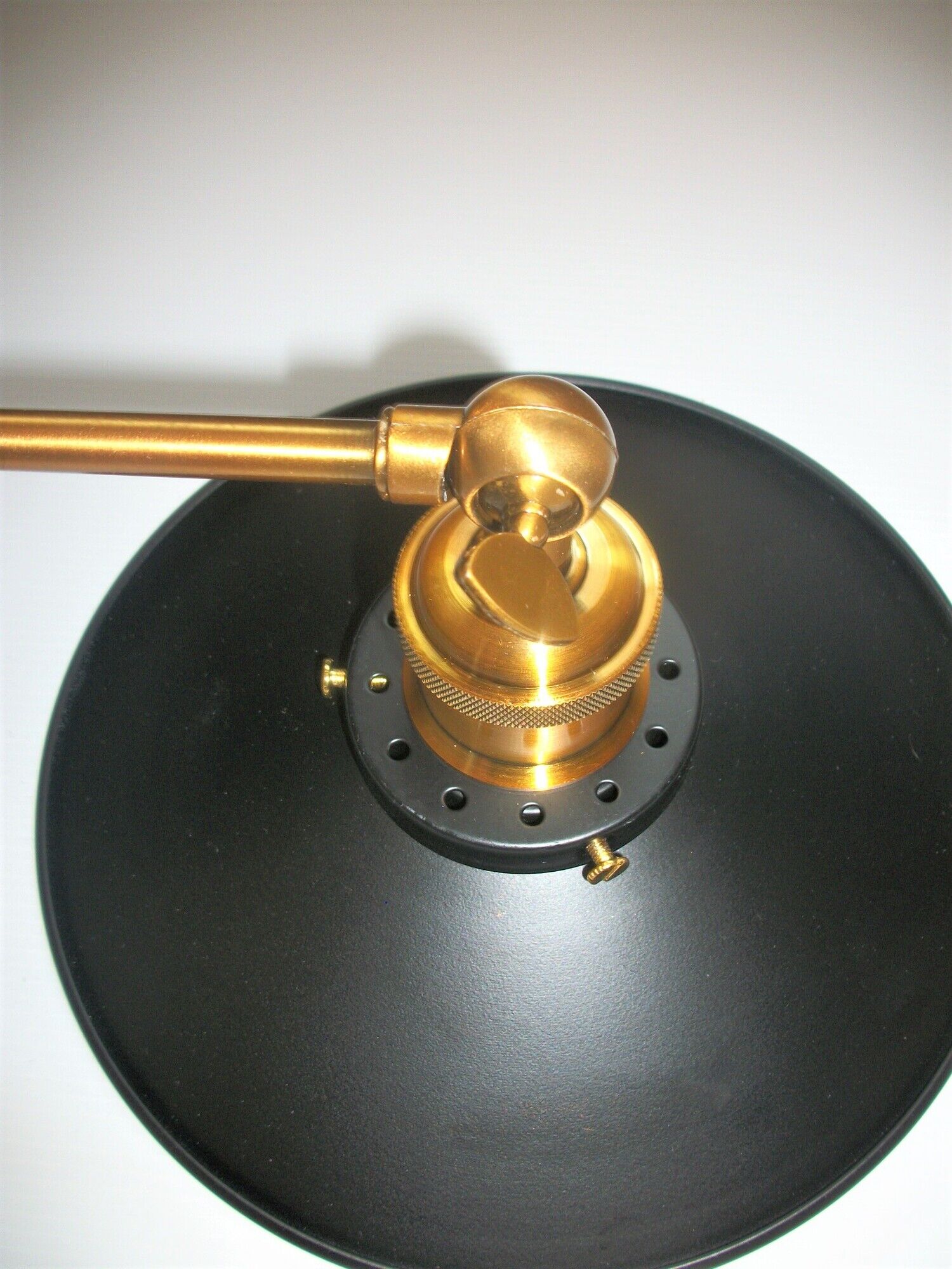 Pair of metal wall lamps in black and gold